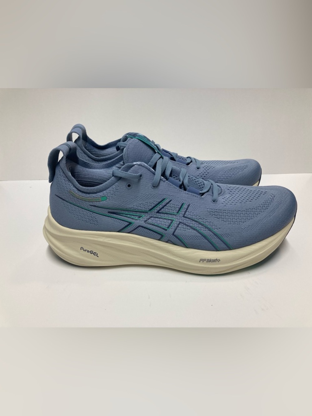 ASICS Gel Nimbus 26 men’s size 13
Light Blue Running Sneaker with Teal Accents
